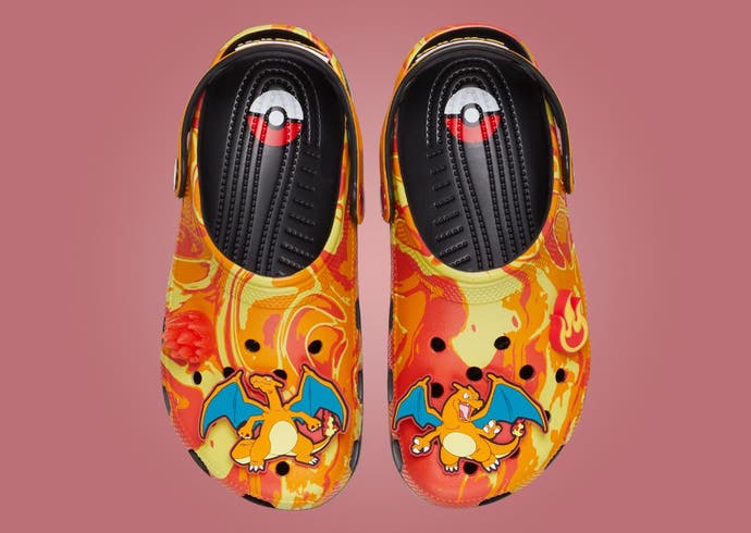 Two bright orange Charizard Crocs next to each other shown from the top